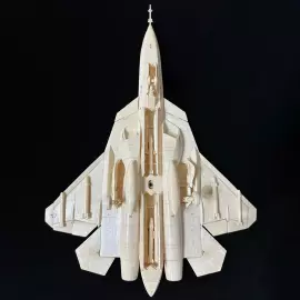 A composite model of the SU-57 mammoth tusk aircraft on a stand